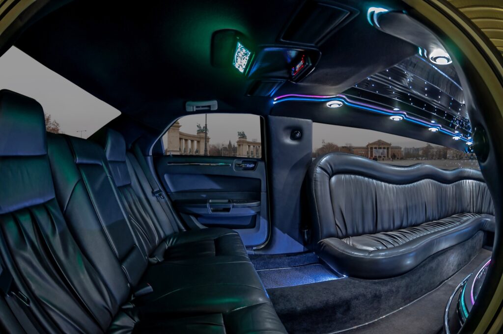 Interior of a luxury Hummer limousine in Budapest with leather seats and LED lights, ideal for stag do parties.