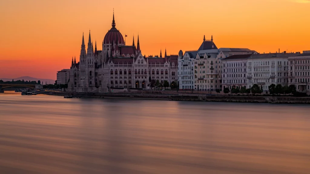 Hungarian Parliament at sunset on the Danube in Budapest, one of the city's most iconic landmarks for bachelor party weekends