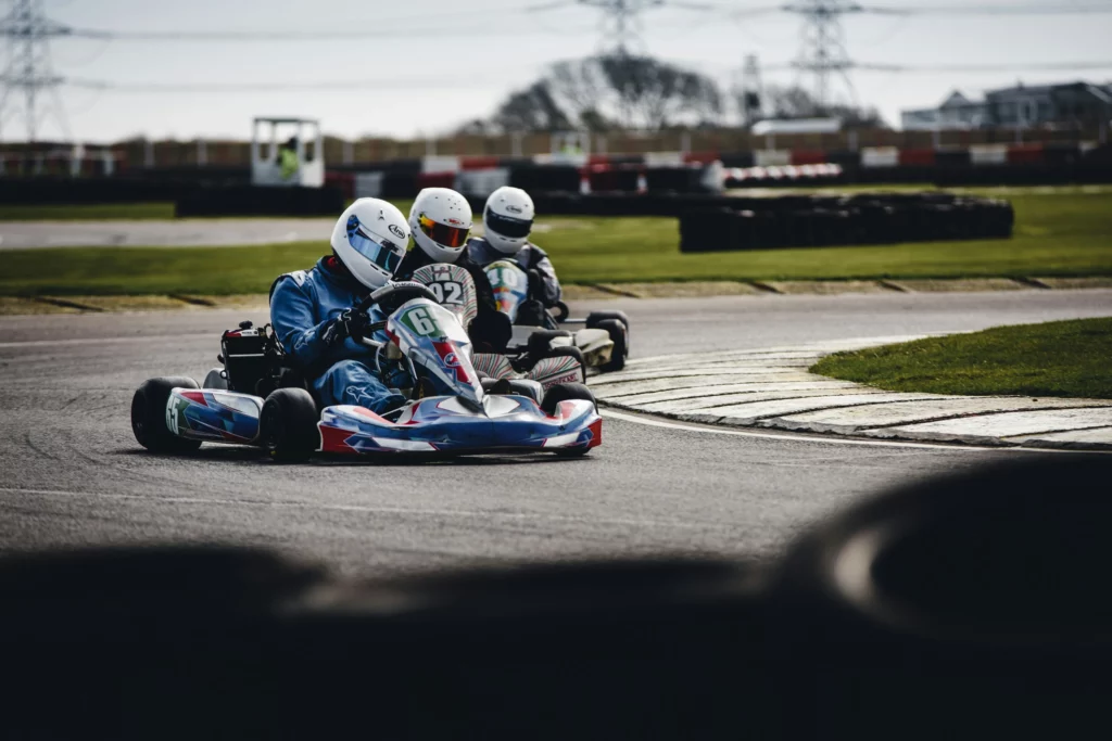 Go-kart racing during a bachelor party in Budapest on a professional outdoor karting circuit