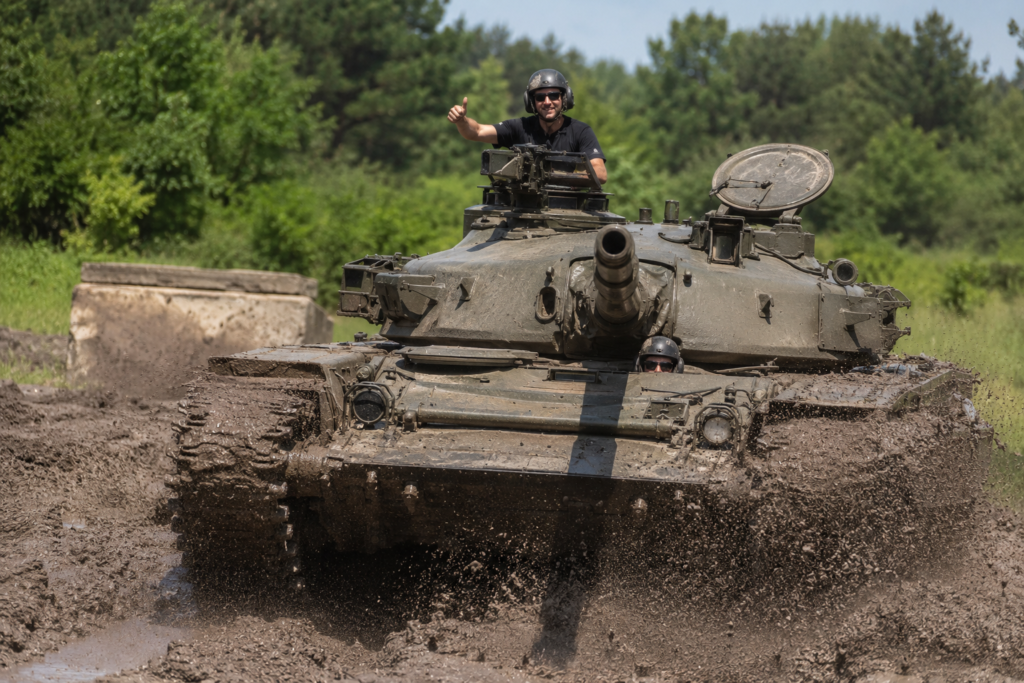 2 Participant driving a real military tank during a bachelor party experience near Budapest