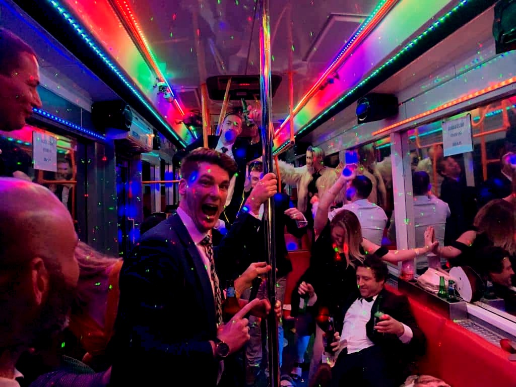 Stag group having fun on a party bus in Budapest