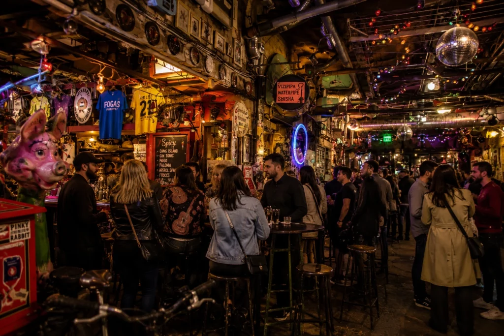 Crowd inside a colourful ruin bar in Budapest