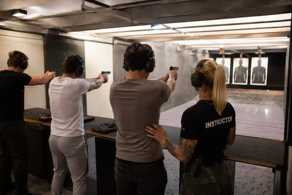 Friends trying an indoor shooting range as an unusual thing to do in Budapest