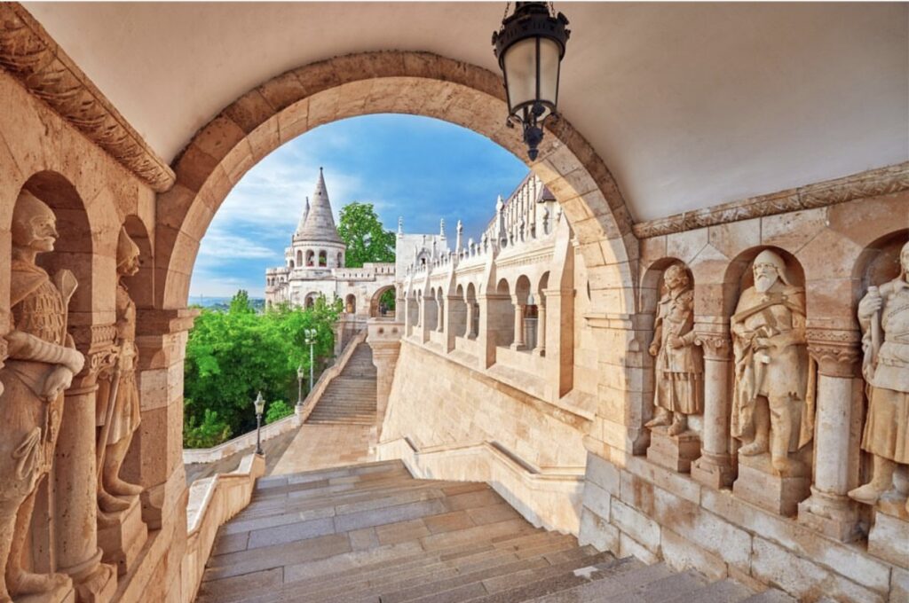 View of Fisherman's Bastion in Budapest, showcasing its beautiful arches, statues, and stunning architectural details.