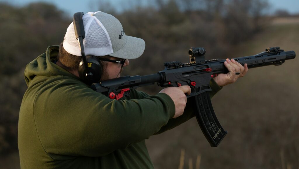 Stag group enjoying a shooting range experience as part of a Budapest stag do itinerary.