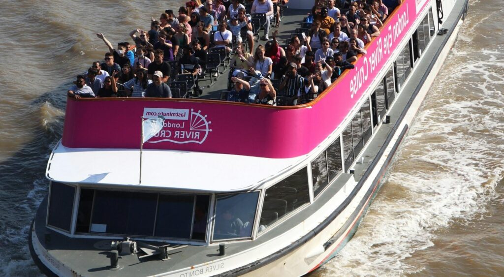 "Friends relaxing on a private boat cruise along the Danube River in Budapest.