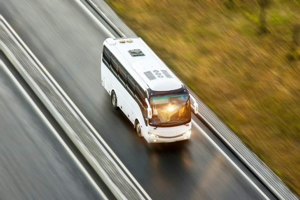 Luxury coach for stag do transfer Budapest, offering spacious and comfortable group transportation on scenic highways.