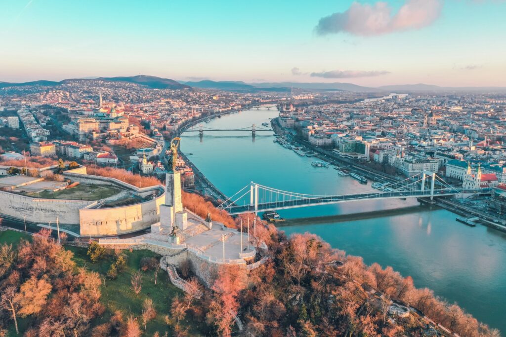 A breathtaking view of Budapest in autumn, featuring the Danube River and Citadella, an ideal destination for stag parties.