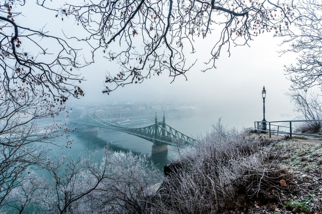 A foggy winter view of Budapest’s Liberty Bridge, a serene location perfect for Outdoor Adventures Stag Budapest experiences