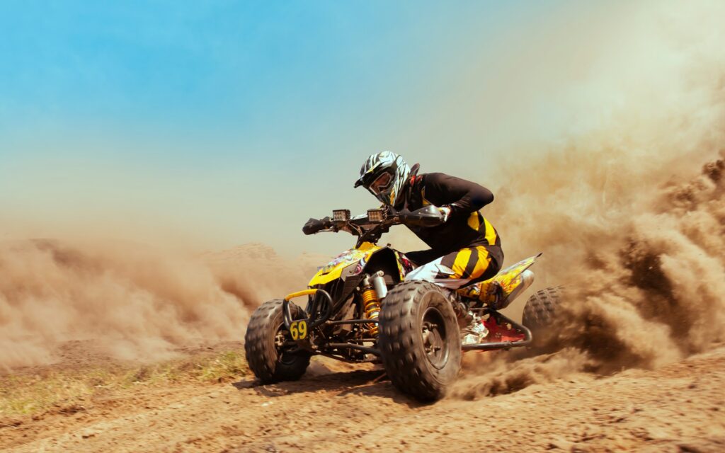 Exciting quad driving adventure on a dirt track, a thrilling activity perfect for Outdoor Adventures Stag Budapest experiences