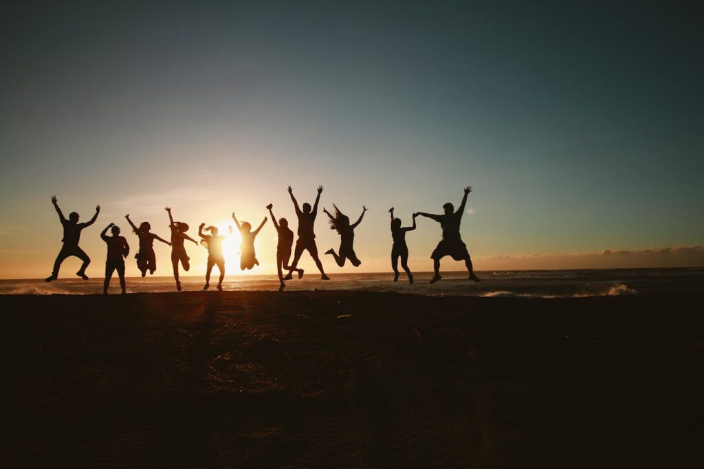 Happy stag group celebrating together at sunset, avoiding Budapest stag do red flags for a perfect trip 