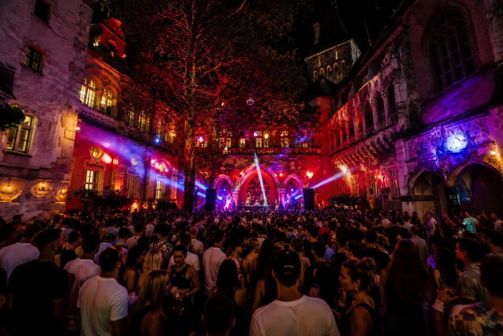 Nightclub party in Budapest with DJ and crowded dance floor